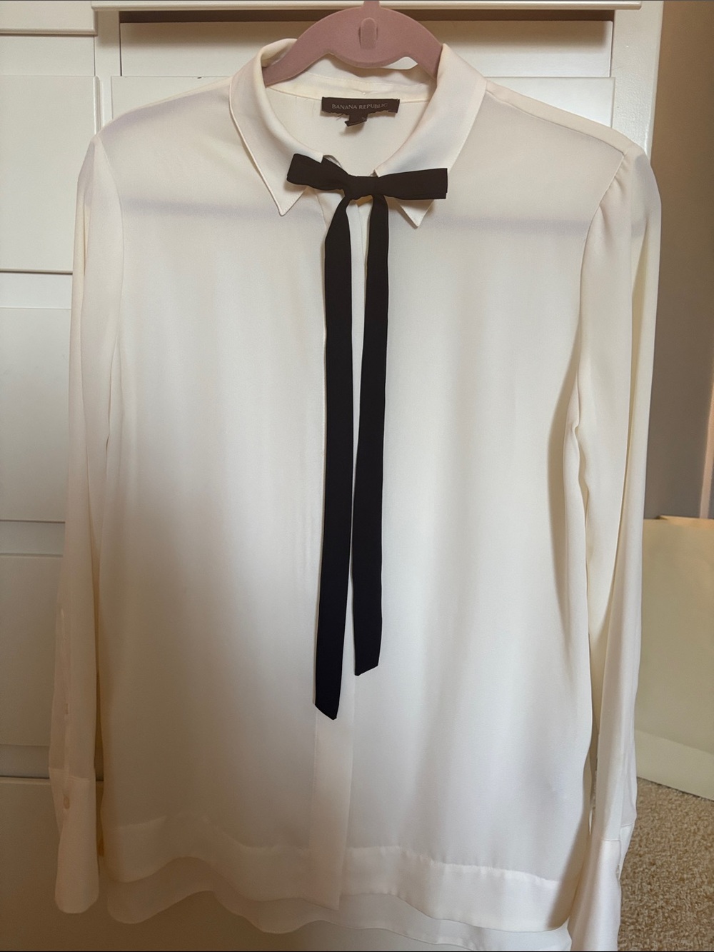 Banana Republic creamy white blouse with long and thin black bow tie